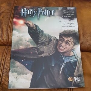 Like new "Alfred" Harry Potter Sheet Music book with blue and gray cover